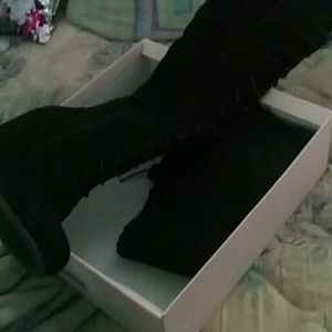 Knee high laced up wedged boots